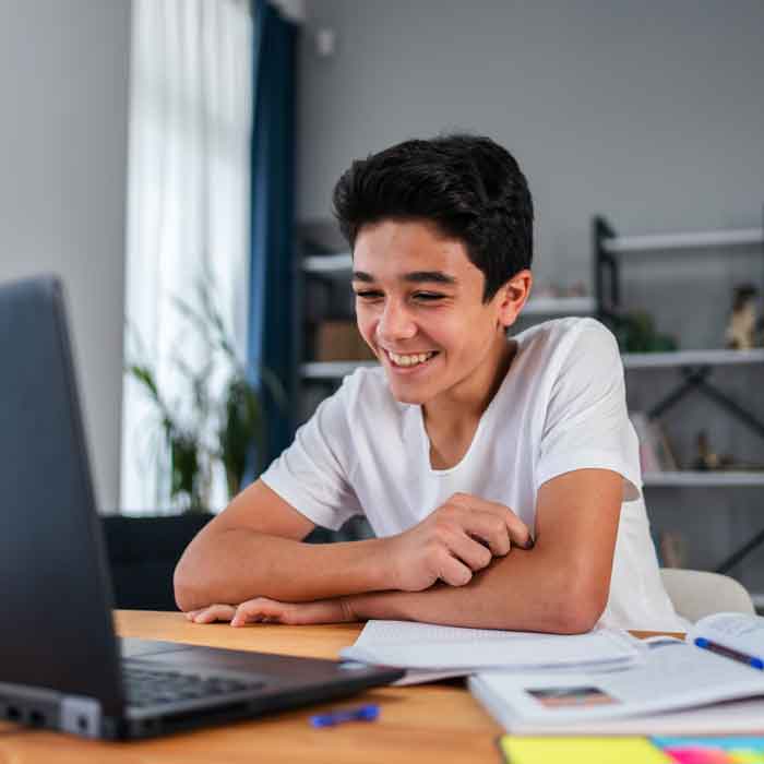 Young teen boy doing Maths and English studying online with ACE Group Tutoring